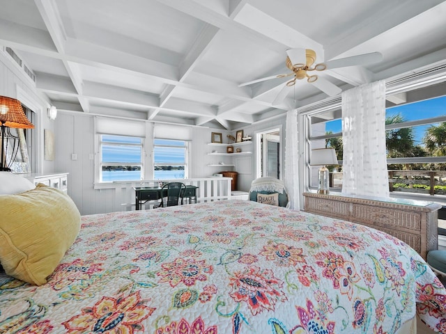 bedroom featuring beamed ceiling, ceiling fan, a water view, and coffered ceiling