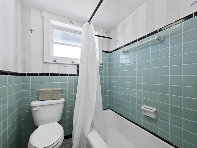 1620 Casey Key Rd, Nokomis, FL 34275 - bathroom with tile walls, shower / tub combo with curtain, and wainscoting
