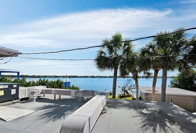 wooden deck featuring a water view