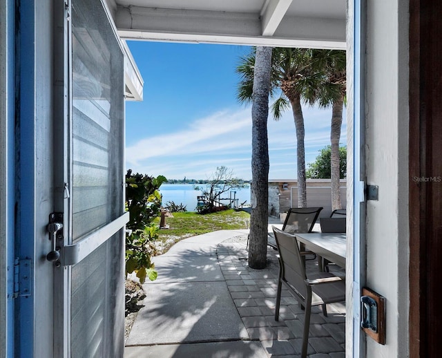 view of patio with a water view