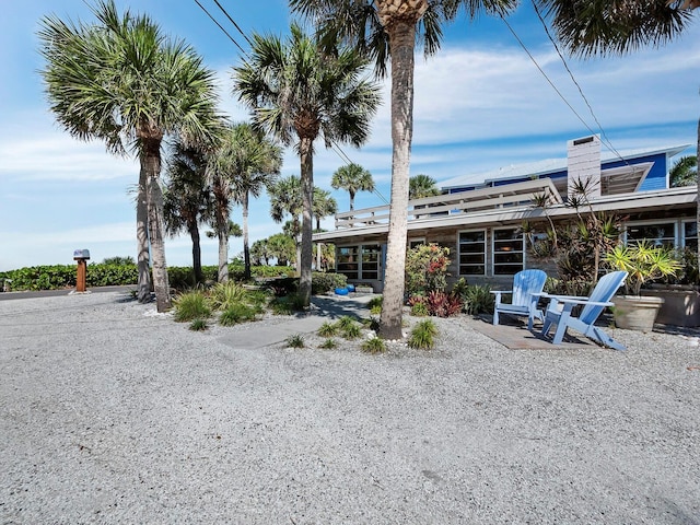 1620 Casey Key Rd, Nokomis, FL 34275 - rear view of property featuring a chimney