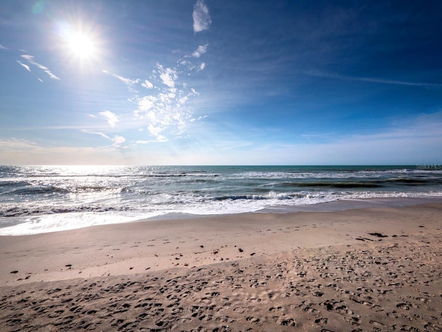 view of water feature with a beach view