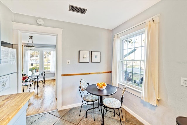 dining area featuring light tile patterned floors