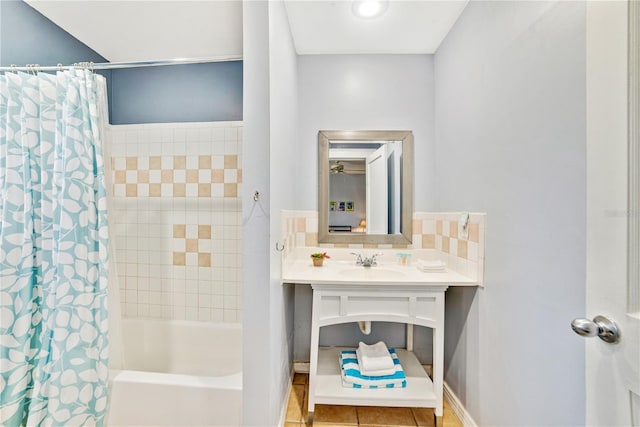 bathroom featuring tasteful backsplash, tile patterned flooring, vanity, and shower / bath combo with shower curtain