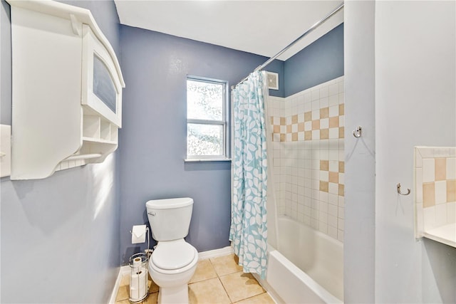 bathroom with shower / bath combination with curtain, tile patterned flooring, baseboards, and toilet