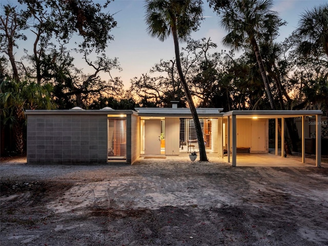 exterior space with a carport