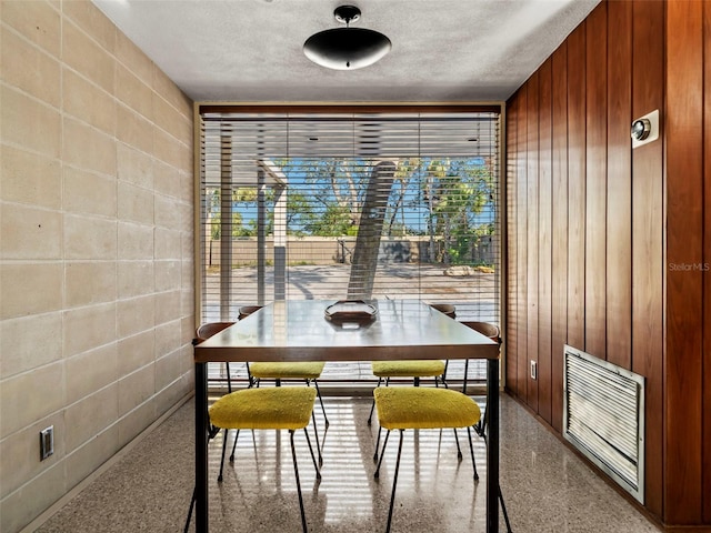 dining area with a textured ceiling