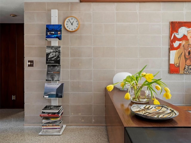 bathroom with tile walls