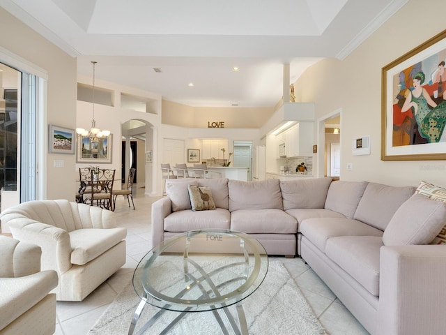 tiled living room with a notable chandelier and ornamental molding