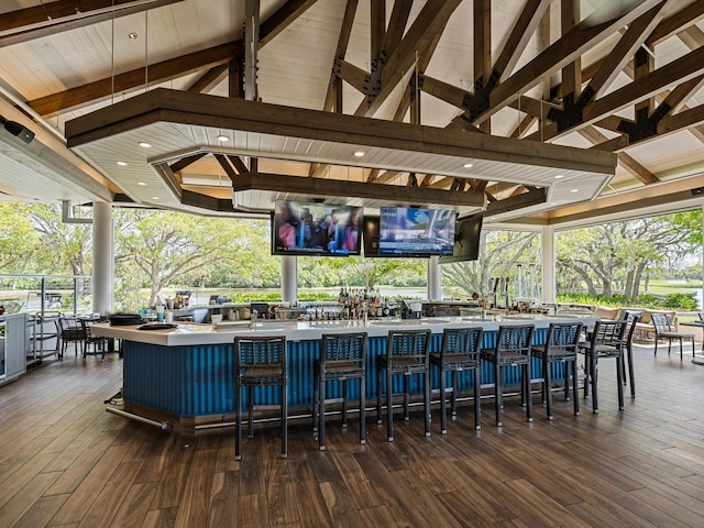 view of swimming pool featuring a gazebo, an outdoor bar, and a wooden deck