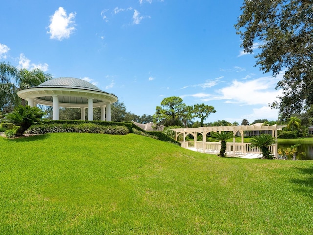 view of yard with a gazebo and a water view