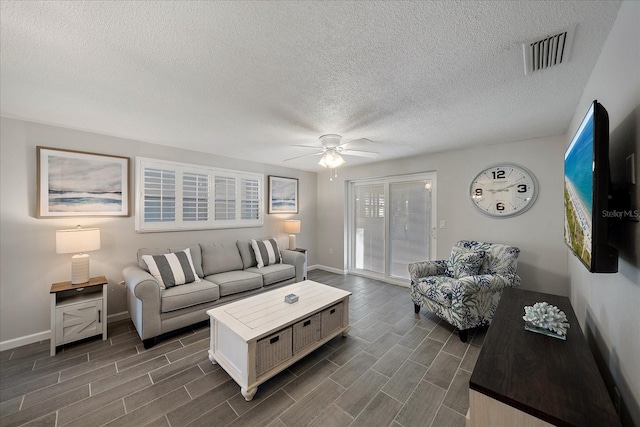1123 Crescent St Unit 1123/1125, Sarasota, FL 34242 - living area featuring baseboards, ceiling fan, dark wood-style floors, and a textured ceiling