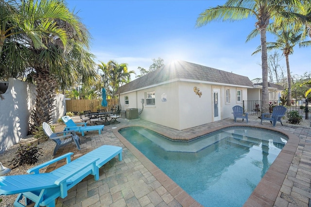 1123 Crescent St Unit 1123/1125, Sarasota, FL 34242 - view of swimming pool with central air condition unit, a patio area, and a fenced backyard