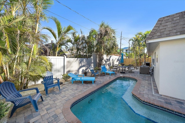 1123 Crescent St Unit 1123/1125, Sarasota, FL 34242 - view of swimming pool with a fenced backyard, a patio, and cooling unit