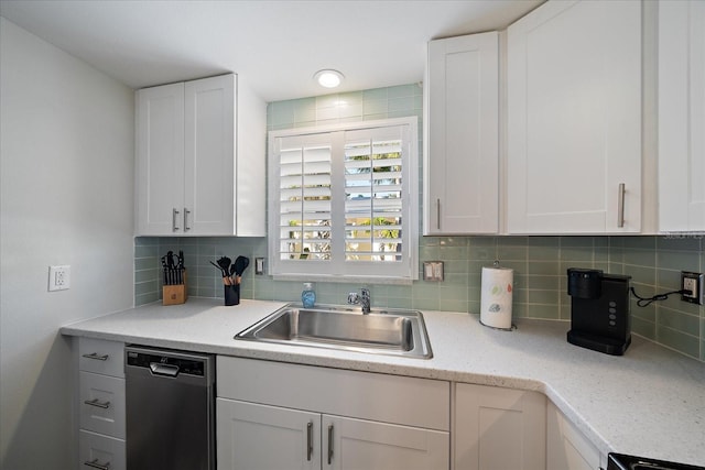 1123 Crescent St Unit 1123/1125, Sarasota, FL 34242 - kitchen with dishwasher, a sink, and white cabinetry