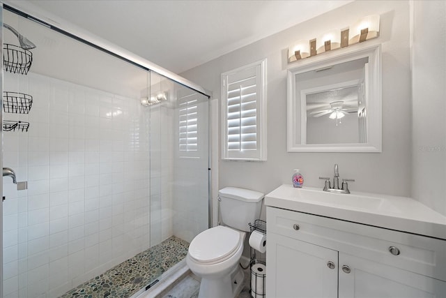 1123 Crescent St Unit 1123/1125, Sarasota, FL 34242 - full bathroom with a stall shower, toilet, vanity, and a ceiling fan