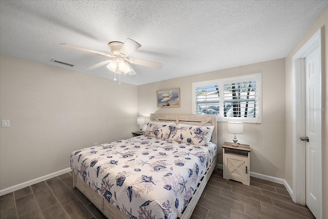 1123 Crescent St Unit 1123/1125, Sarasota, FL 34242 - bedroom featuring wood finish floors, baseboards, a textured ceiling, and a ceiling fan