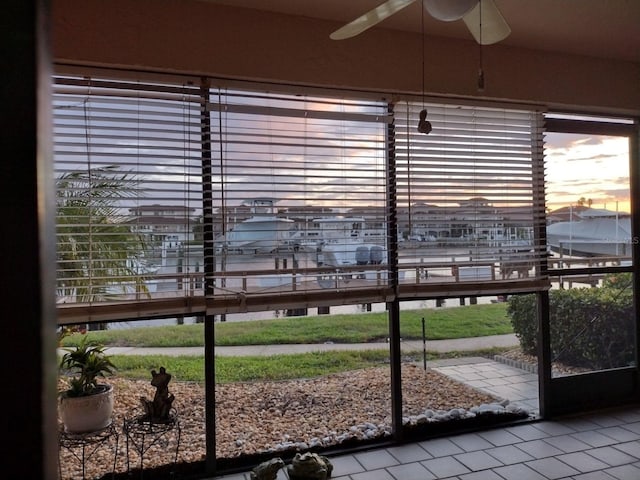 sunroom / solarium with ceiling fan