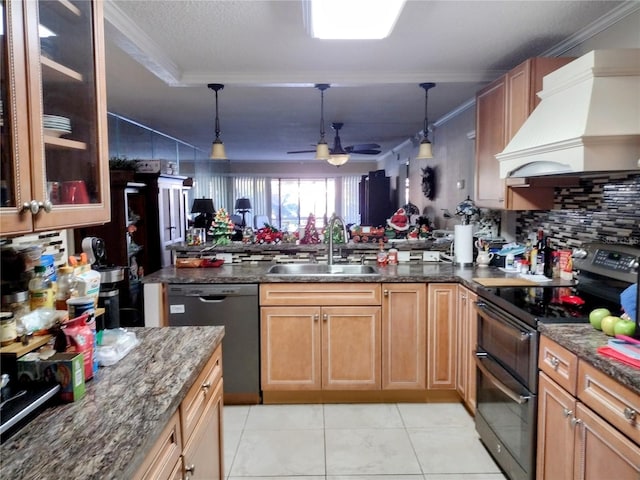 kitchen featuring pendant lighting, black appliances, sink, ornamental molding, and custom range hood