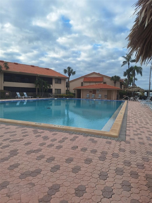 view of swimming pool featuring a patio area