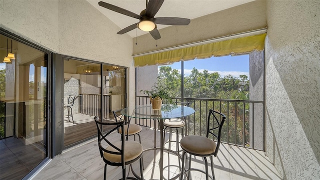 sunroom / solarium with ceiling fan