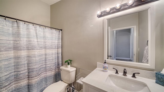 bathroom with a shower with curtain, vanity, a textured ceiling, and toilet