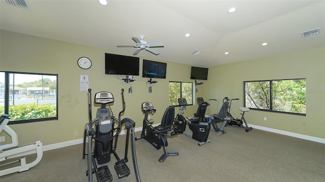 workout area featuring ceiling fan and carpet flooring