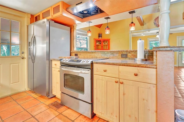 kitchen featuring ornate columns, hanging light fixtures, extractor fan, light tile patterned flooring, and appliances with stainless steel finishes