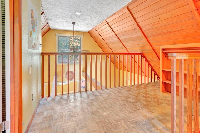 additional living space featuring parquet flooring, wood ceiling, and vaulted ceiling