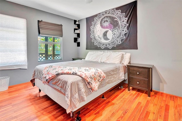 bedroom with hardwood / wood-style flooring