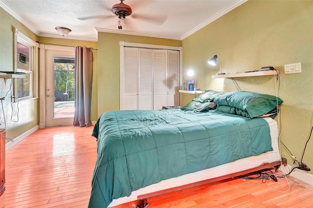 bedroom with access to exterior, a closet, ornamental molding, and ceiling fan