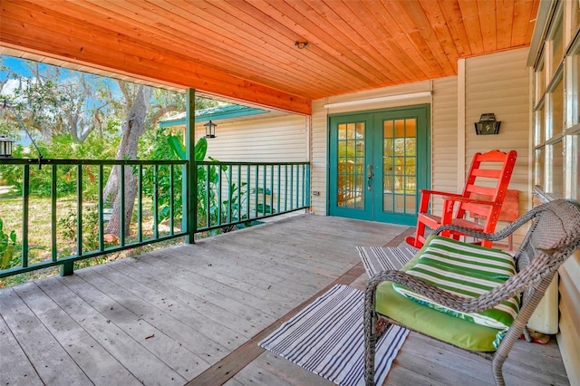 wooden deck featuring french doors