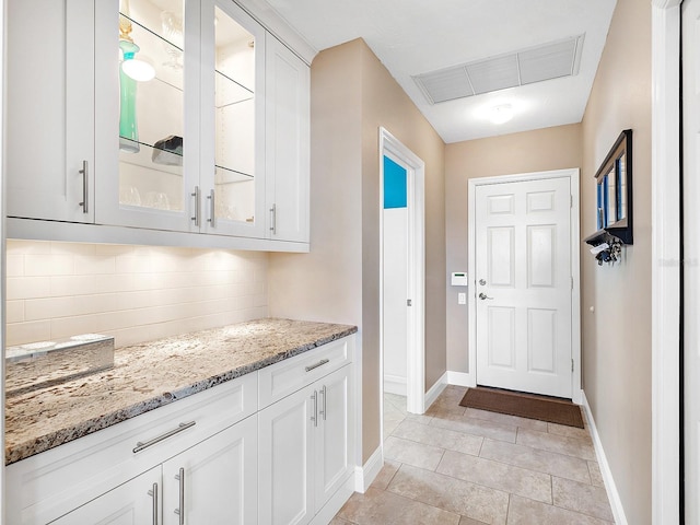 doorway featuring light tile patterned floors