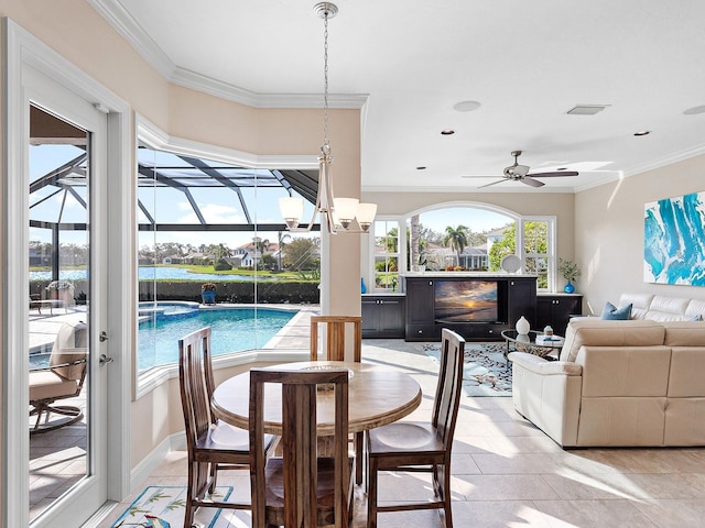 dining area featuring ceiling fan, light tile patterned floors, and ornamental molding