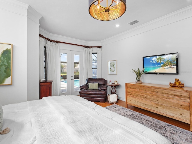 bedroom with access to exterior, french doors, hardwood / wood-style flooring, and ornamental molding