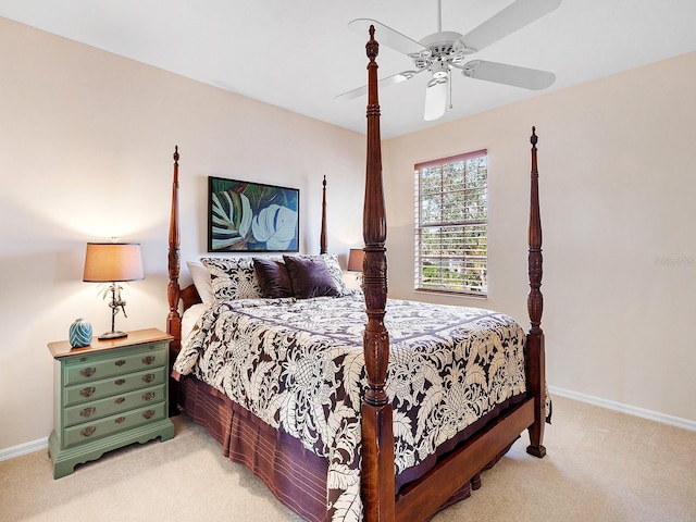 bedroom featuring light carpet and ceiling fan