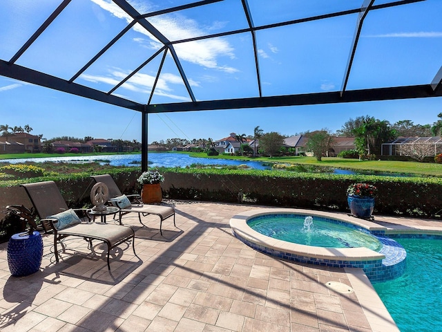 view of pool featuring glass enclosure, an in ground hot tub, a water view, and a patio