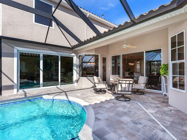 view of pool featuring a patio and ceiling fan