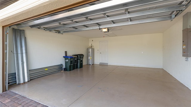 garage featuring a garage door opener, electric panel, and water heater