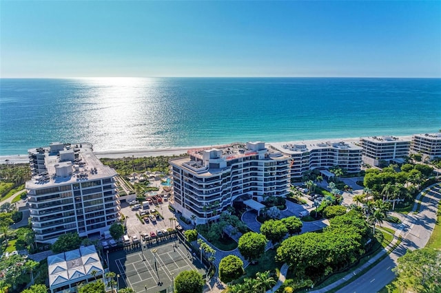 bird's eye view with a water view and a view of the beach