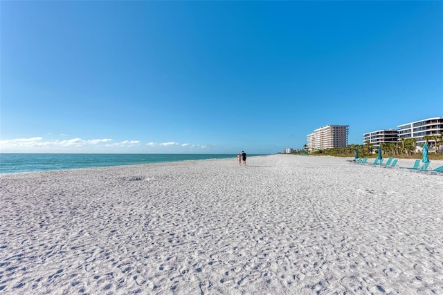 property view of water featuring a beach view