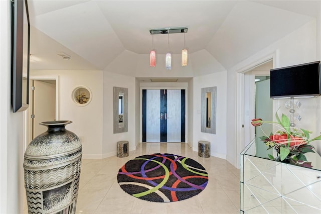 interior space with lofted ceiling and french doors