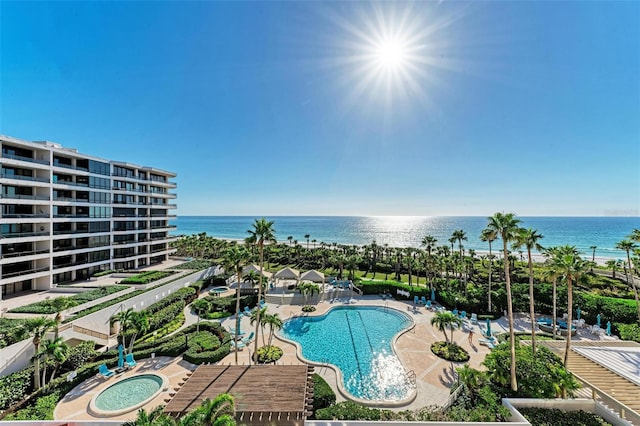 view of pool with a water view