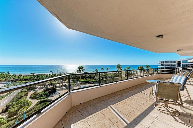 balcony featuring a water view