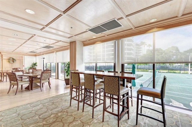 sunroom featuring coffered ceiling