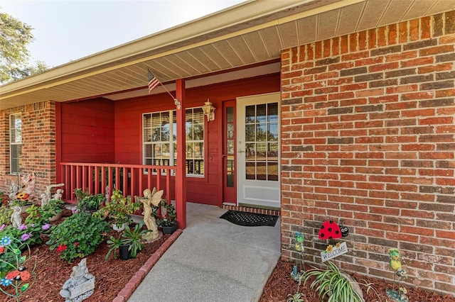 entrance to property featuring covered porch