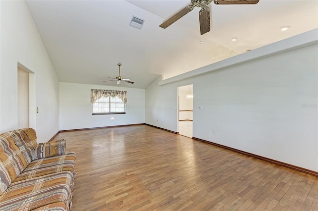 unfurnished living room featuring ceiling fan, wood-type flooring, and lofted ceiling