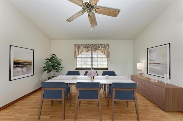 dining space with light hardwood / wood-style floors and ceiling fan