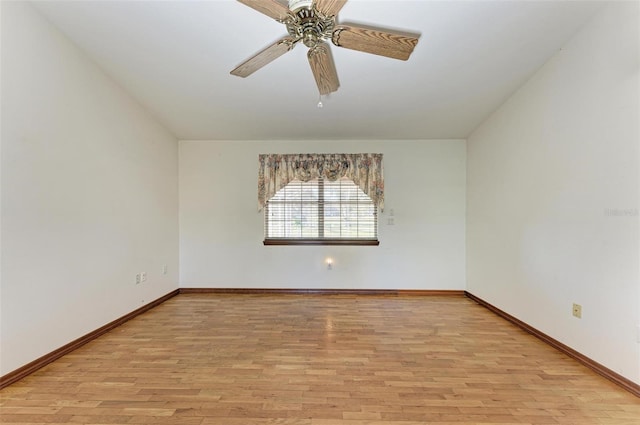 spare room with ceiling fan and light wood-type flooring