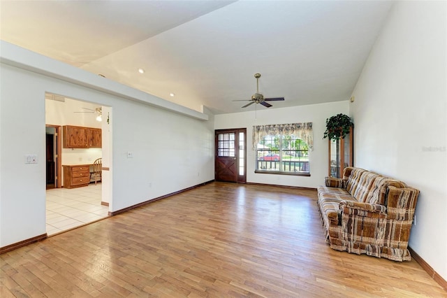 unfurnished living room with light hardwood / wood-style flooring and lofted ceiling